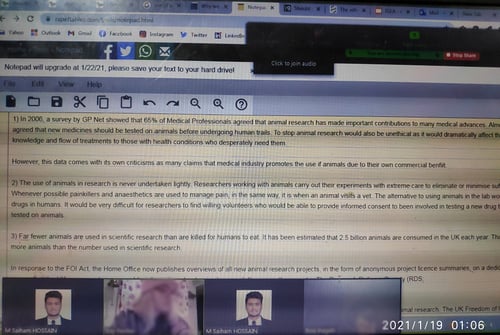 Saiham taking notes on computer whilst stdying