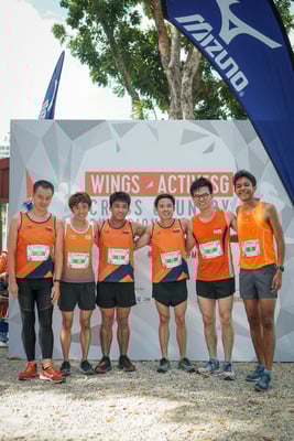 posing for finish point after marathon