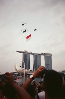 Singapore Flag above hotel by helicopter